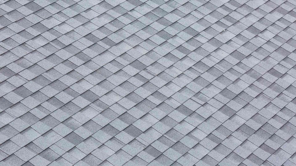 Image of light grayish blue shingles, installed in Livingston, NJ by professional roofers.