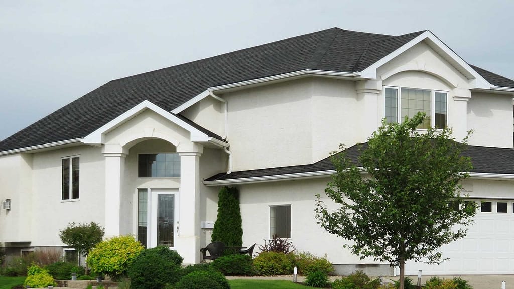 white big house  and gray shingle by Summit NJ roofing contractors