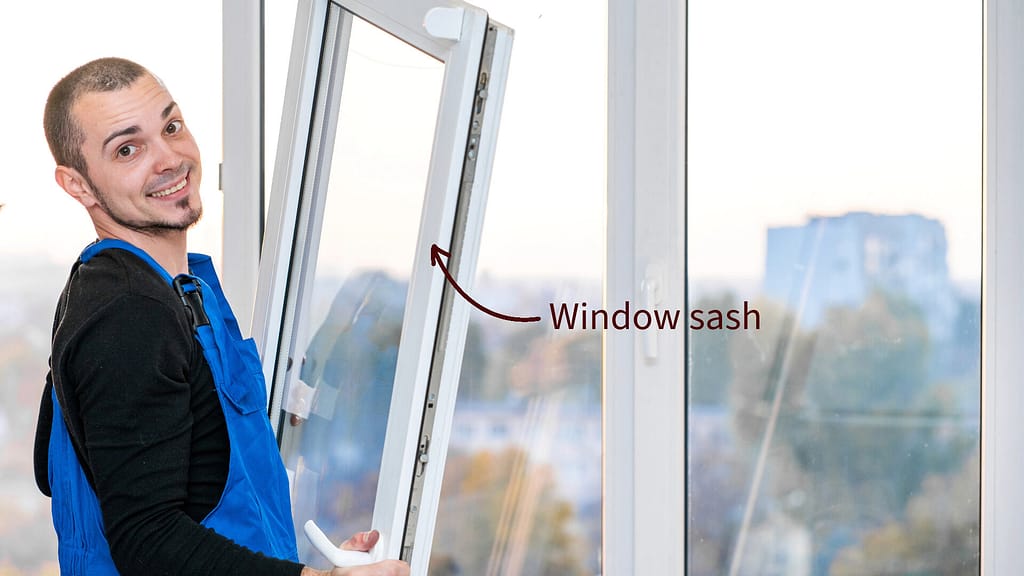 Person holding a window sash
