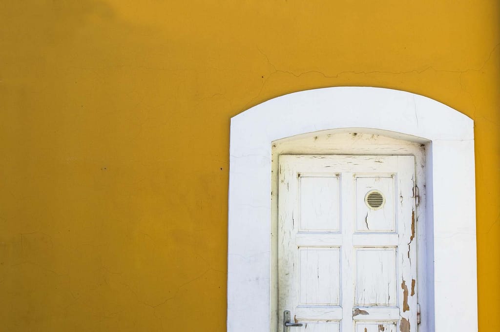 white doors nj and yellow wall