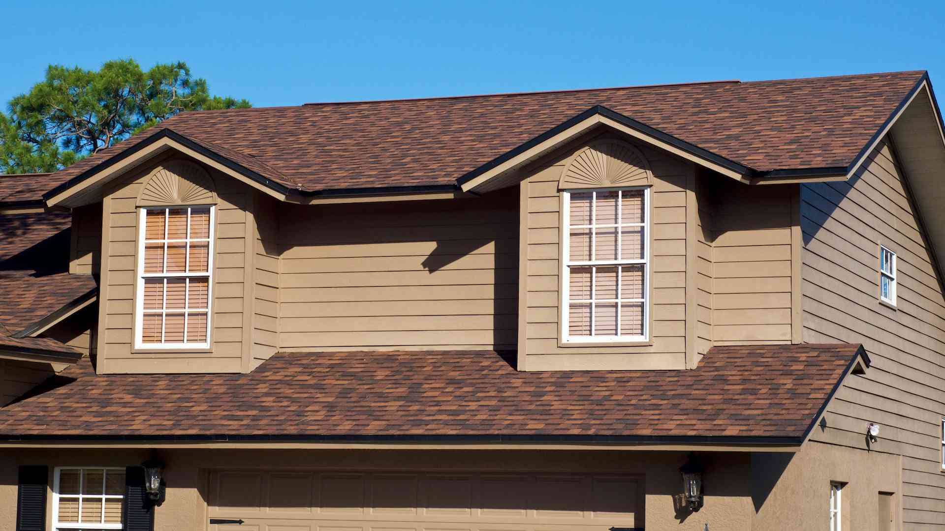 Beautiful brown house with high-quality dark brown asphalt shingles by American Home Contractors in Parsippany, NJ.