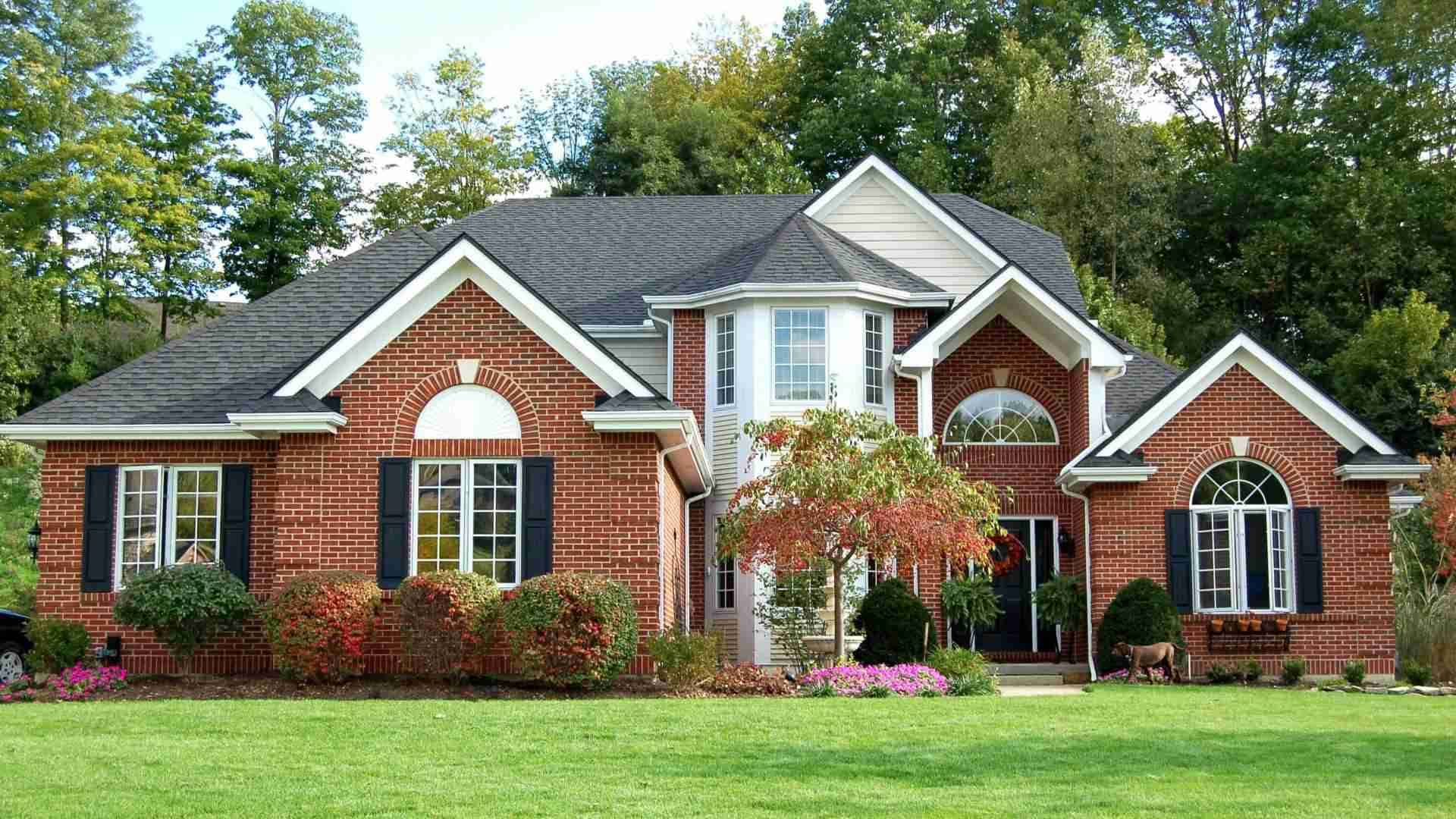 Brick home with new roof in nj by American Home Contractors, roofing company new jersey