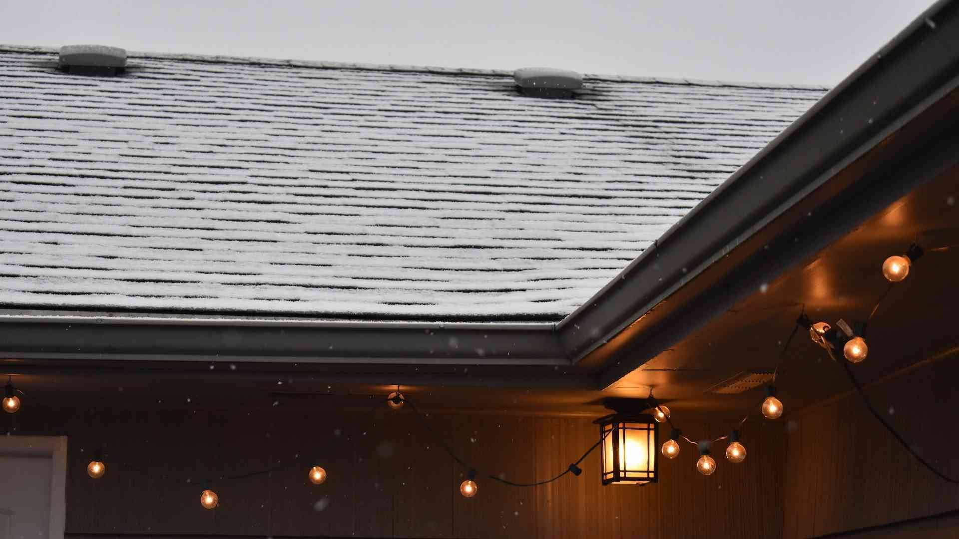 Asphalt roof with a light dusting of snow, installed by American Home Contractors in Berkeley Heights, NJ.